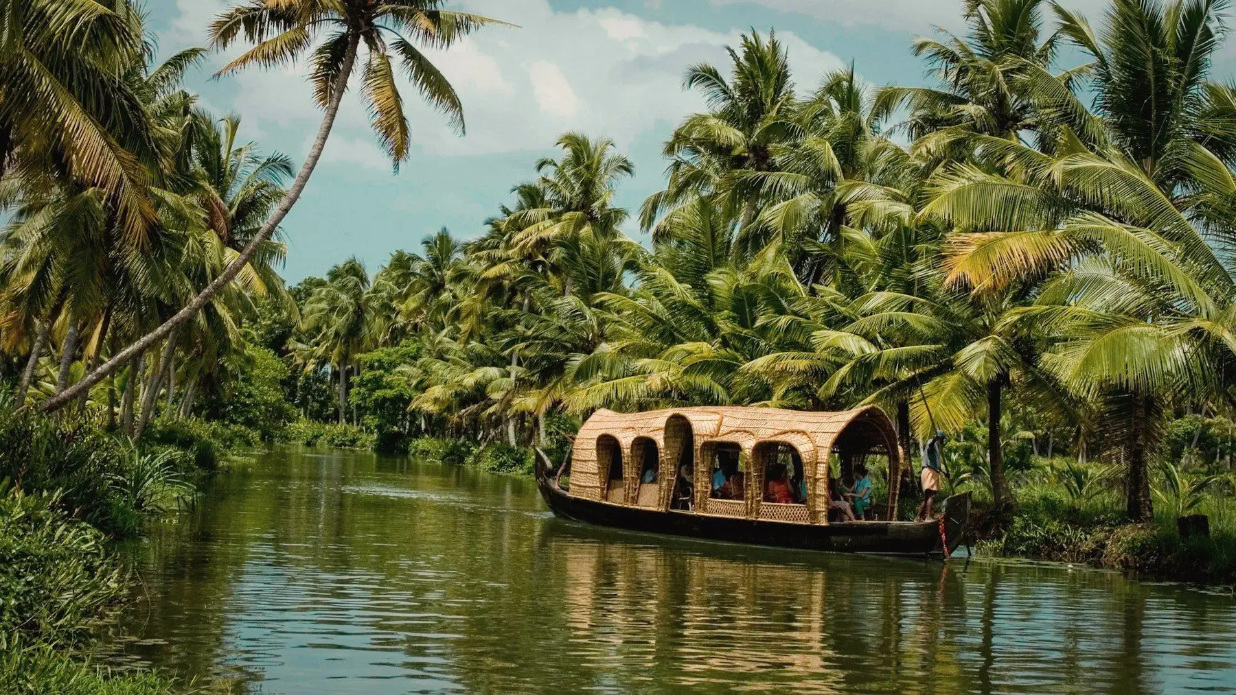 A houseboat on the palm-lined Kerala backwaters