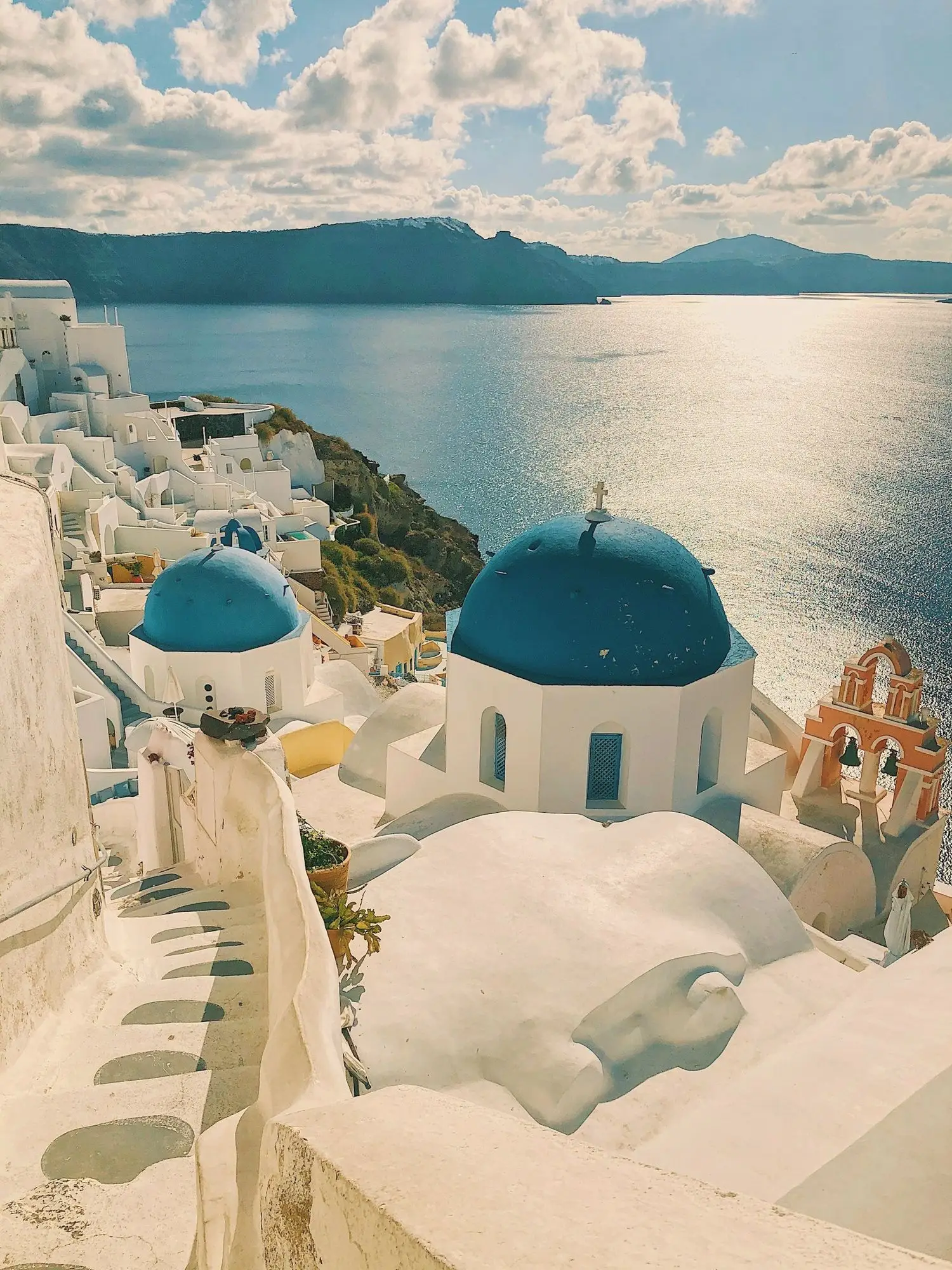 Blue-domed churches above the Aegean in Santorini