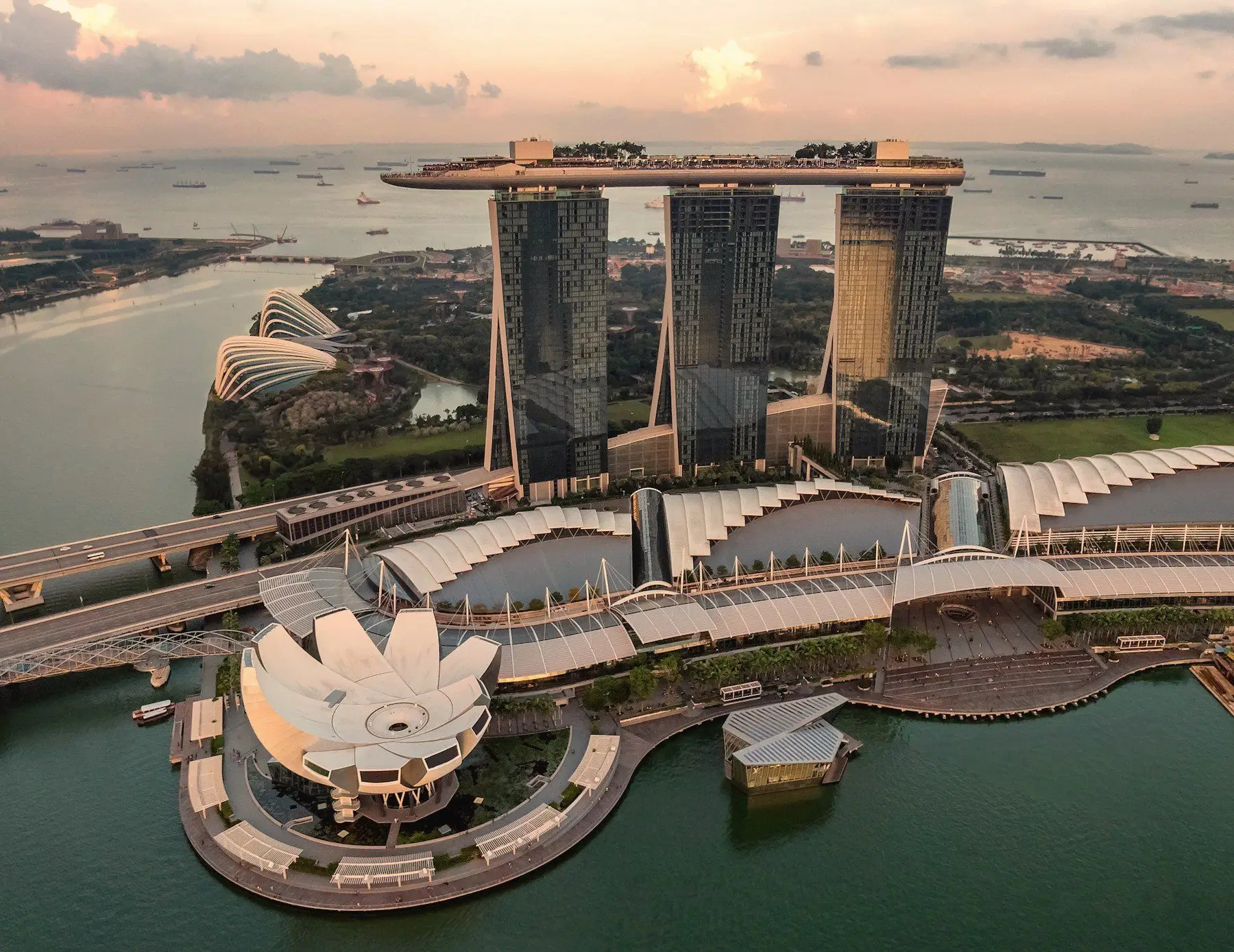 Marina Bay Sands and the ArtScience Museum above the bay at sunset