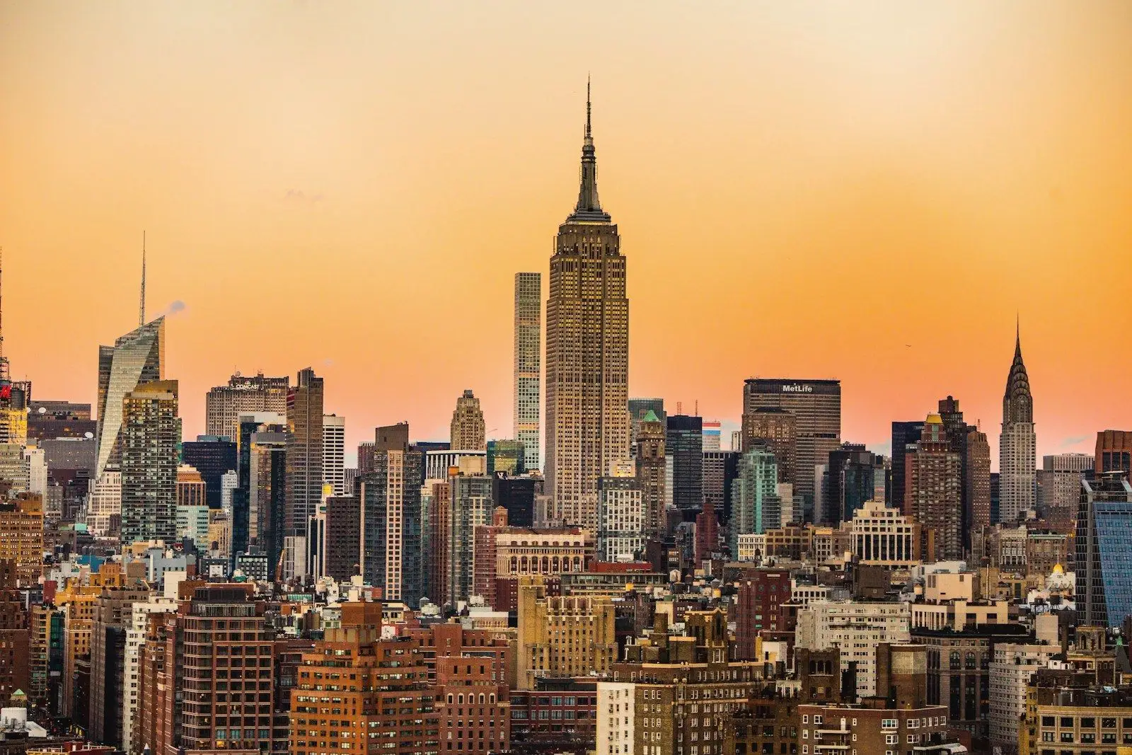Manhattan skyline and the Empire State Building glowing at sunset