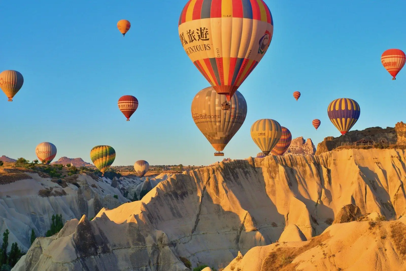 Hot-air balloons drifting over the rock formations of Cappadocia