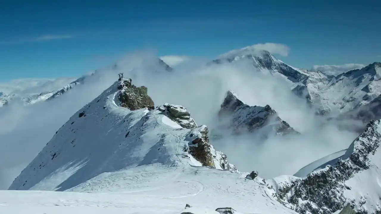 Snow-covered Himalayan peaks rising above drifting cloud